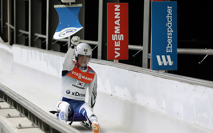 Lim Namkyu, Korea's second luger to head down the track, punches the touchpad as he crosses the finish line in the Viessmann Luge Team Relay World Cup.